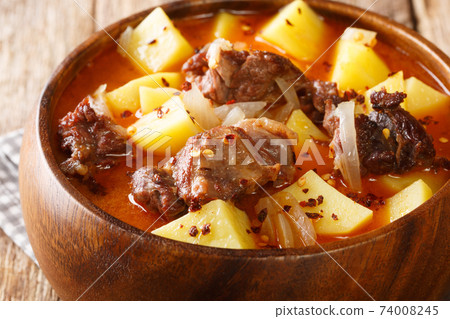 Bonava Mauritanian Lamb stew with potatoes in hot sauce close-up in a bowl. Horizontal 74008245