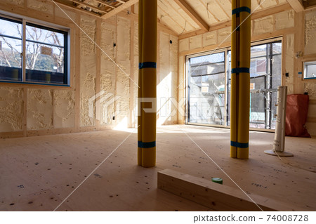 Construction site of a newly built single-family house with spray insulation Construction site of a newly built single-family house with spray insulation 74008728