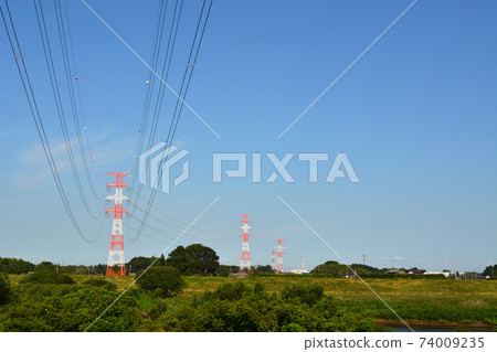 Steel towers, power lines and rural landscapes Steel towers, power lines and rural landscapes 74009235