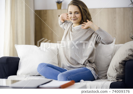 Happy brunette woman put hands behind head sitting leaned on couch european female enjoy lazy weekend or vacation in cozy living room, housewife relaxing feels satisfied after housework Happy brunette woman put hands behind head sitting leaned on couch european female enjoy lazy weekend or vacation in cozy living room, housewife relaxing feels satisfied after housework 74009376