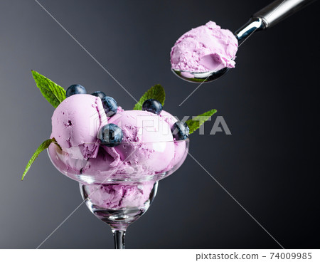 Blueberry ice cream with mint and berries. 74009985