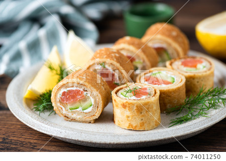 Crepe rolls with salmon and cream cheese Crepe rolls with salmon and cream cheese 74011250