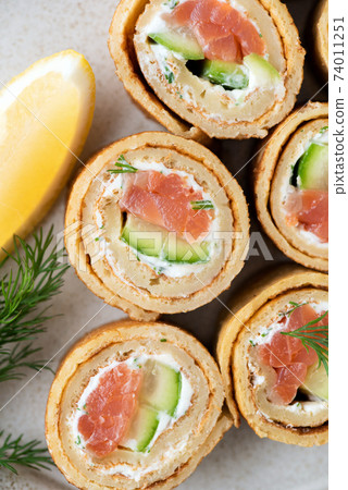 Crepe rolls with salmon, cucumber and cream cheese 74011251