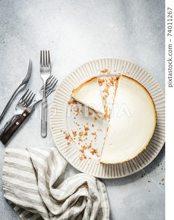 New york cheesecake on concrete background New york cheesecake on concrete background 74011267