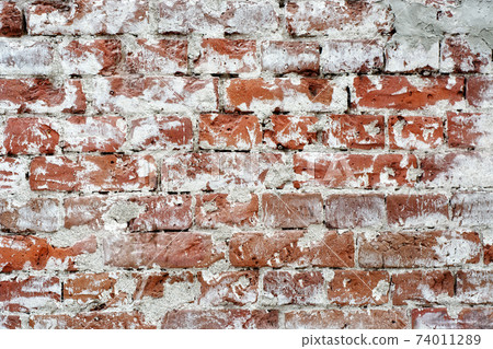 Wall of old brick. 74011289