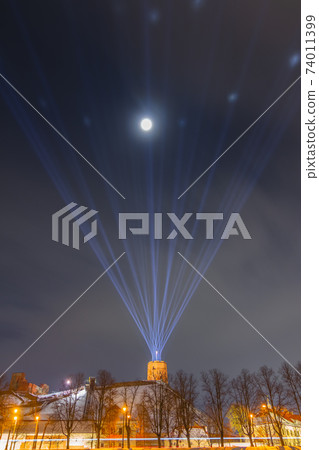 Vilnius, Lithuania - January 25, 2021: Vilnius main symbol, Gediminas castle illuminated for 698 city birthday celebrations Vilnius, Lithuania - January 25, 2021: Vilnius main symbol, Gediminas castle illuminated for 698 city birthday celebrations 74011399
