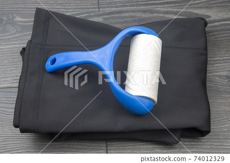 sticky plastic roller for cleaning clothes from dust, lint and hair sticky plastic roller for cleaning clothes from dust, lint and hair 74012329