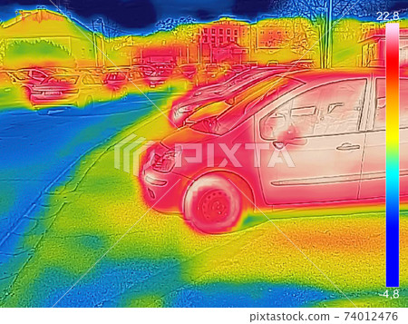 Thermal image showing parked cars at town parking a lot of Thermal image showing parked cars at town parking a lot of 74012476