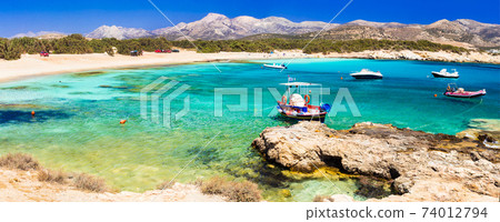 Beautiful wild beaches of Naxos island. Scenery with fishing boats Beautiful wild beaches of Naxos island. Scenery with fishing boats 74012794