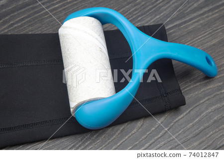 sticky plastic roller for cleaning clothes from dust, lint and hair sticky plastic roller for cleaning clothes from dust, lint and hair 74012847