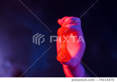 Liquid sugar for skin epilation rubber gloves close-up. Liquid sugar for skin epilation rubber gloves close-up. 74014870