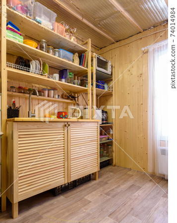 Interior of a small kitchen in a country cottage Interior of a small kitchen in a country cottage 74014984