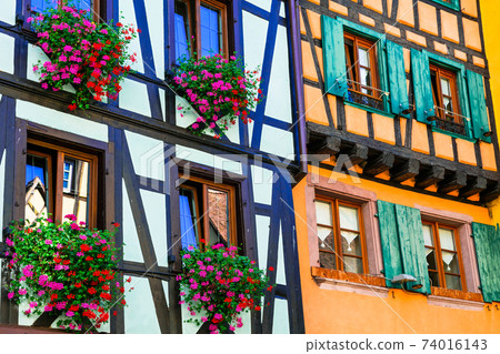 Traditional architecture of Alsace - half timbred colourful houses, Riquewihr village, France 74016143