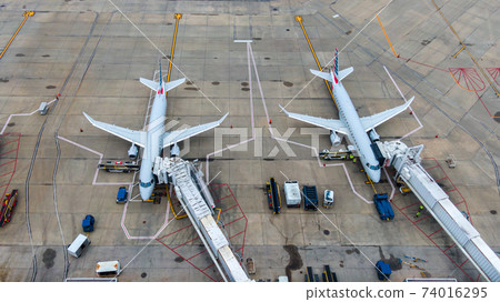 Aerial view of regional airport with terminal and airplanes Aerial view of regional airport with terminal and airplanes 74016295