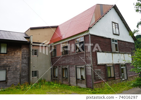 Ruined mountain lodge building Ruined mountain lodge building 74016297