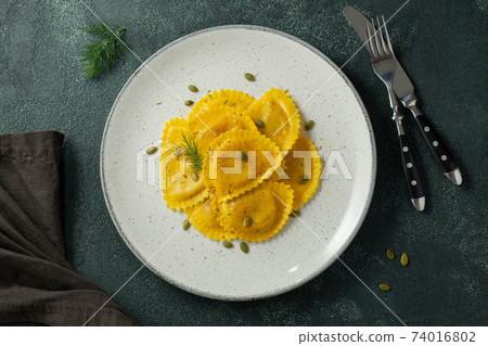 Homemade Pumpkin Ravioli with butter Homemade Pumpkin Ravioli with butter 74016802