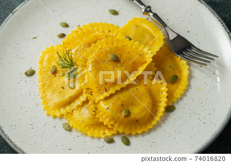 Homemade Pumpkin Ravioli with butter Homemade Pumpkin Ravioli with butter 74016820