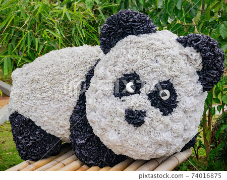 Close up shot of a panda shape flower art Close up shot of a panda shape flower art 74016875
