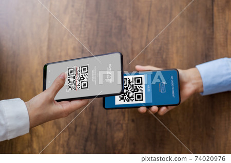 QR code payment, online shopping, E wallet, cashless technology concept. Human hand paying with qr code on smartphone screen in stores that accept digital payments without money. QR code payment, online shopping, E wallet, cashless technology concept. Human hand paying with qr code on smartphone screen in stores that accept digital payments without money. 74020976