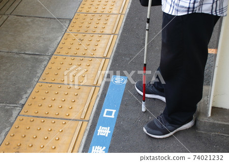Visually disabled people waiting for the train at the station 74021232