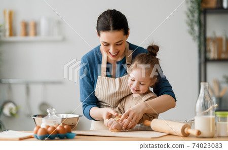 family are preparing bakery together 74023083