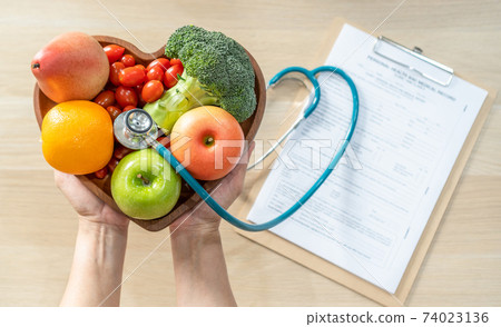 Nutritional food for heart health wellness by cholesterol diet and healthy nutrition eating with clean fruits and vegetables in heart dish by nutritionist and doctor recommended for patient well-being Nutritional food for heart health wellness by cholesterol diet and healthy nutrition eating with clean fruits and vegetables in heart dish by nutritionist and doctor recommended for patient well-being 74023136