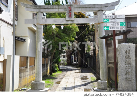 Torii gate and road sign at Ebisu Shrine in Kamakura City 74024394