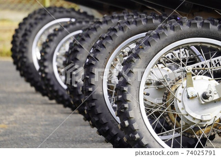 Lined up motocross bike off-road tires 74025791
