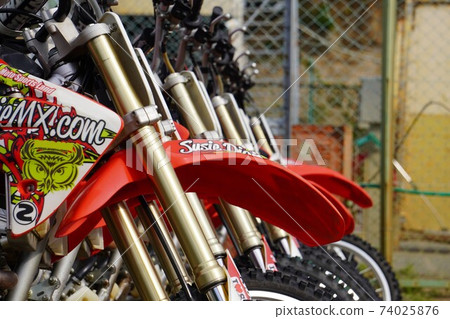 Close-up of side-by-side motocross bikes 74025876