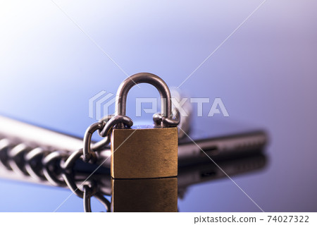 Modern smartphone with a lock. Data protection. Mobile phone security concept Modern smartphone with a lock. Data protection. Mobile phone security concept 74027322