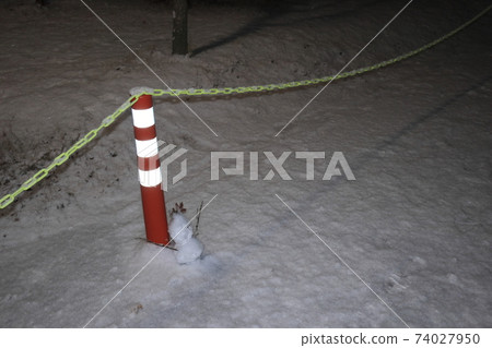 A fenced view of a snowy night A fenced view of a snowy night 74027950