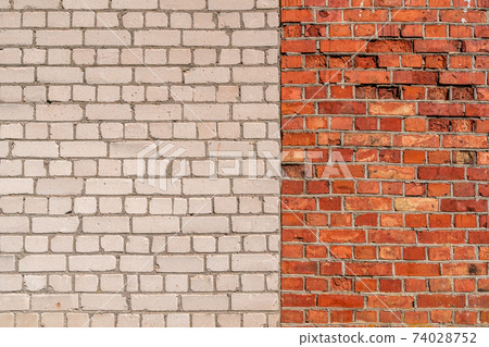 Brick wall full frame with two sections of different colours 74028752