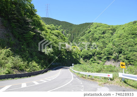 Road leading from the mountain 74028933