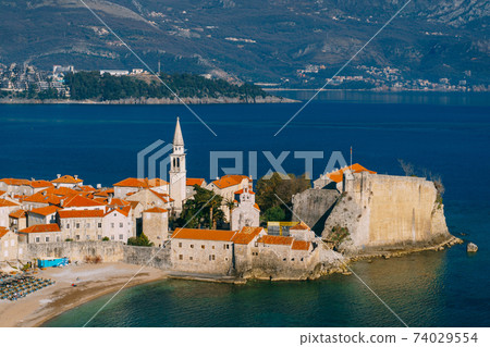 The old town of Budva, the blue sea and the mountains. 74029554