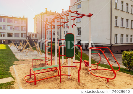Exercise machines on the street in the school yard Exercise machines on the street in the school yard 74029640