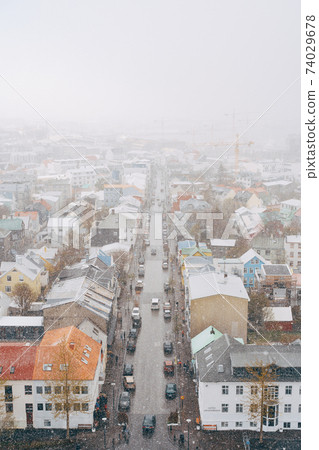 Panoramic view of Reykjavik city and Atlantic ocean coast from the top of Hallgrimskirkja church. Reykjavik is the capital and largest city of Iceland. Panoramic view of Reykjavik city and Atlantic ocean coast from the top of Hallgrimskirkja church. Reykjavik is the capital and largest city of Iceland. 74029678