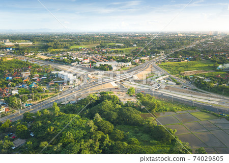 Aerial view of highway road and intersection road in Chiang Mai of Thailand. Aerial view of highway road and intersection road in Chiang Mai of Thailand. 74029805