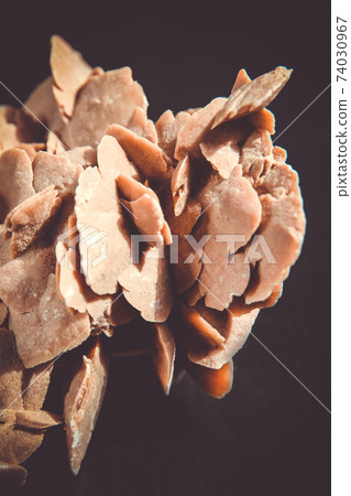 Desert rose crystal isolated on black background Desert rose crystal isolated on black background 74030967