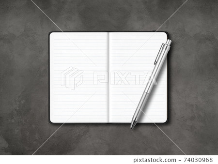 Black open lined notebook with a pen isolated on dark concrete background Black open lined notebook with a pen isolated on dark concrete background 74030968