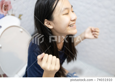 Happy asian people sitting on the toilet bowl,defecating or urinating in the bathroom,smiling child girl with relief and satisfaction,good excretory system,daily routine,defecate and urinate concept Happy asian people sitting on the toilet bowl,defecating or urinating in the bathroom,smiling child girl with relief and satisfaction,good excretory system,daily routine,defecate and urinate concept 74031910
