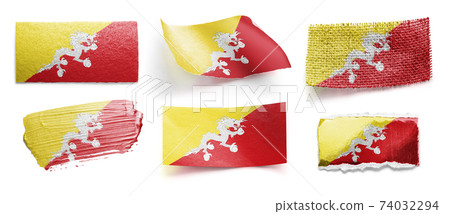 Small national flags of the Bhutan on a dark background Small national flags of the Bhutan on a dark background 74032294