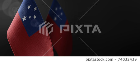 Small national flags of the Samoa on a dark background 74032439