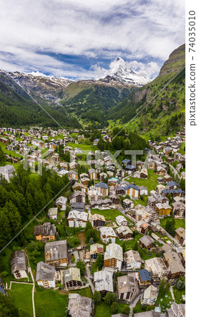 Beautiful vertical panorama of Zermatt Valley and Matterhorn Peak, Switzerland Beautiful vertical panorama of Zermatt Valley and Matterhorn Peak, Switzerland 74035010