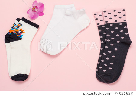 Women socks on pink background. Top view. Women socks on pink background. Top view. 74035657