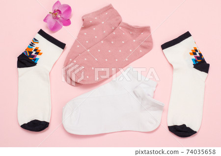 Women socks on pink background. Top view. Women socks on pink background. Top view. 74035658