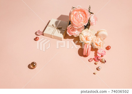 Monochrome floral layout with copy space in peach pastel color. Minimal spring concept Monochrome floral layout with copy space in peach pastel color. Minimal spring concept 74036502