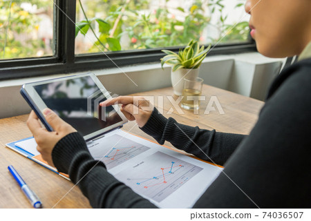 Close up of woman hands using tablet indoor Close up of woman hands using tablet indoor 74036507