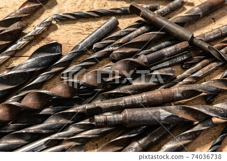 old vintage hand tools - set of drills on a wooden background old vintage hand tools - set of drills on a wooden background 74036738