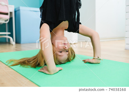 Close up sportive child face upside down Close up sportive child face upside down 74038168