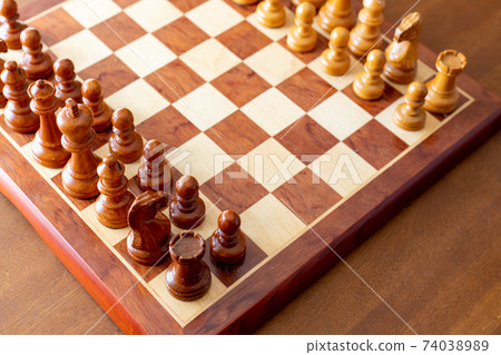 Wooden chess board and chess pieces 74038989